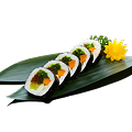 Naeki's Vegetable futomaki sushi rolls (5 pieces) with flower garnish on bamboo leaf.