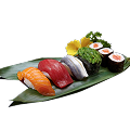 A close-up shot of a Naeki's sushi platter on a green bamboo leaf. The platter includes a variety of nigiri and maki sushi, such as salmon nigiri, tuna nigiri, mackerel nigiri, seaweed gunkan, and salmon maki rolls. A yellow chrysanthemum and a sprig of green garnish are placed at the top right. The background is completely black, making the sushi stand out.