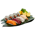 A close-up shot of a Naeki's sushi platter on a green bamboo leaf. The platter includes different types of sushi, arranged from bottom left to top right. In the front row are nigiri pieces: one salmon, one tuna, one flounder fin, and one shrimp. In the back row are four salmon maki rolls topped with sesame seeds. A sprig of green garnish and two pieces of tamago (sweet egg) sushi are placed at the top right. The background is completely black, making the sushi stand out.