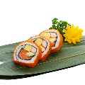 Naeki's Salmon and crab stick Uramaki sushi rolls (3 pieces) with tobiko, tamagoyaki, green vegetable, flower, and parsley garnish on bamboo leaf.