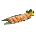 A close-up shot of Naeki's six pieces of seared salmon nigiri sushi presented on a green bamboo leaf. A yellow chrysanthemum and a sprig of green garnish are placed next to the sushi. The background is completely black, making the vibrant colors of the seared salmon stand out.