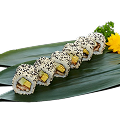 Naeki's Unagi (eel) sushi rolls (7 pieces) with tamagoyaki, avocado, black sesame, and flower garnish on bamboo leaf.