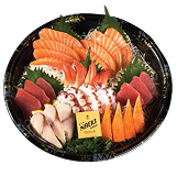 Naeki's platter of assorted sashimi is arranged on a black and gold decorative dish. The dish contains various raw seafood, including two fan-shaped arrangements of bright orange salmon, slices of red tuna, and a pile of mottled pink octopus tentacles in the center. A small yellow bottle of soy sauce sits next to some white fish slices and bright orange imitation crab sticks.
